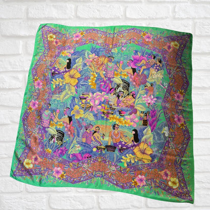 Colorful fabric with a vibrant design on a white brick wall background