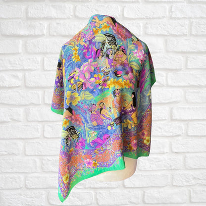 Colorful scarf with a vibrant design on a white brick wall background