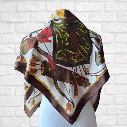 Decorative scarf with vintage design on a white brick wall background