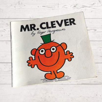 Book titled 'Mr. Clever' by Roger Hargreaves on a light wooden surface