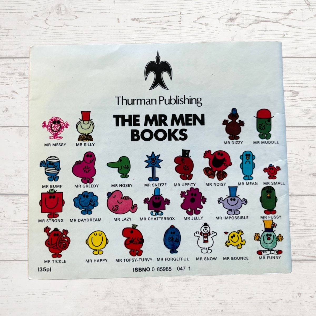 Back Book Cover for 'The Mr Men Books' by Thurman Publishing with character illustrations on a light wooden background.
