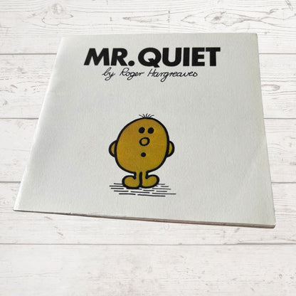 Book titled 'Mr. Quiet' by Roger Hargreaves on a white wooden surface