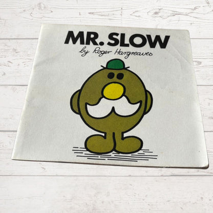 Book titled 'MR. SLOW by Roger Hargreaves' with a cartoon character on a white background