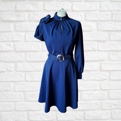 Navy Bkue 70s dress with silver buckle belt on a white background 