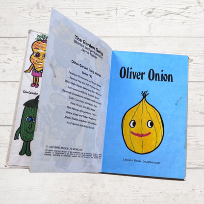 Open book showing a page with an illustration of Oliver Onion from 'The Garden Gang' series.