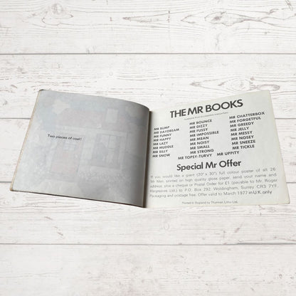 Open book with text on a wooden surface