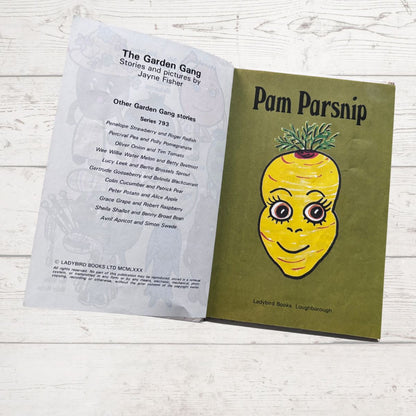Book titled 'Pam Parsnip' with a smiling yellow parsnip illustration on a white wooden surface.