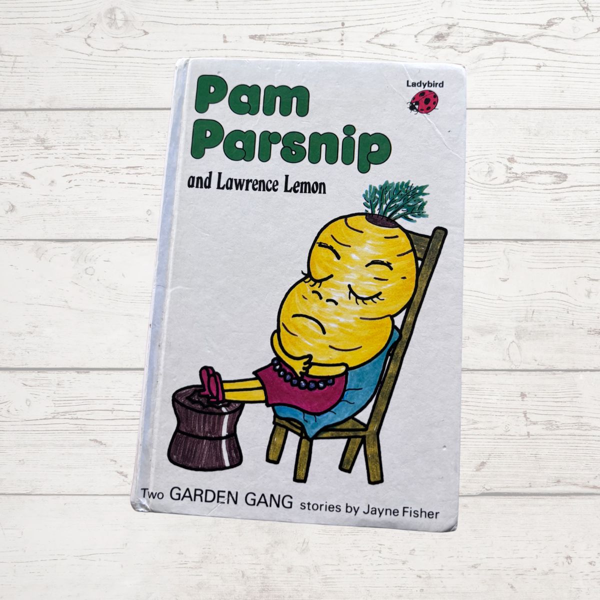 Book titled 'Pam Parsnip and Lawrence Lemon' on a white wooden surface