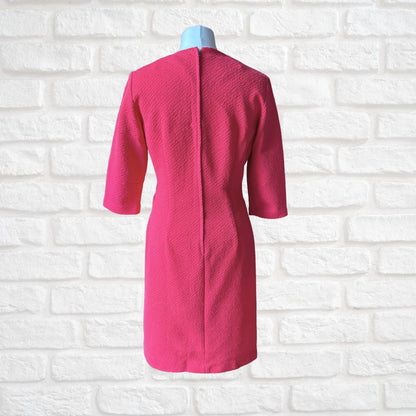 Pink 60s scooter dress with zip up back On a white background 