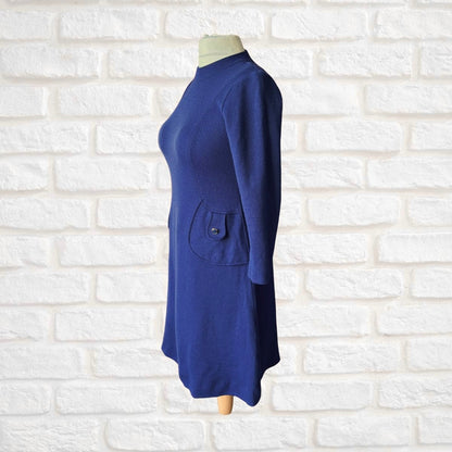 Side view of 60s scooter dress in purple 