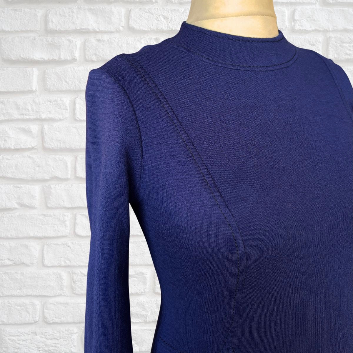 Purple wool dress with long sleeved on a white background 