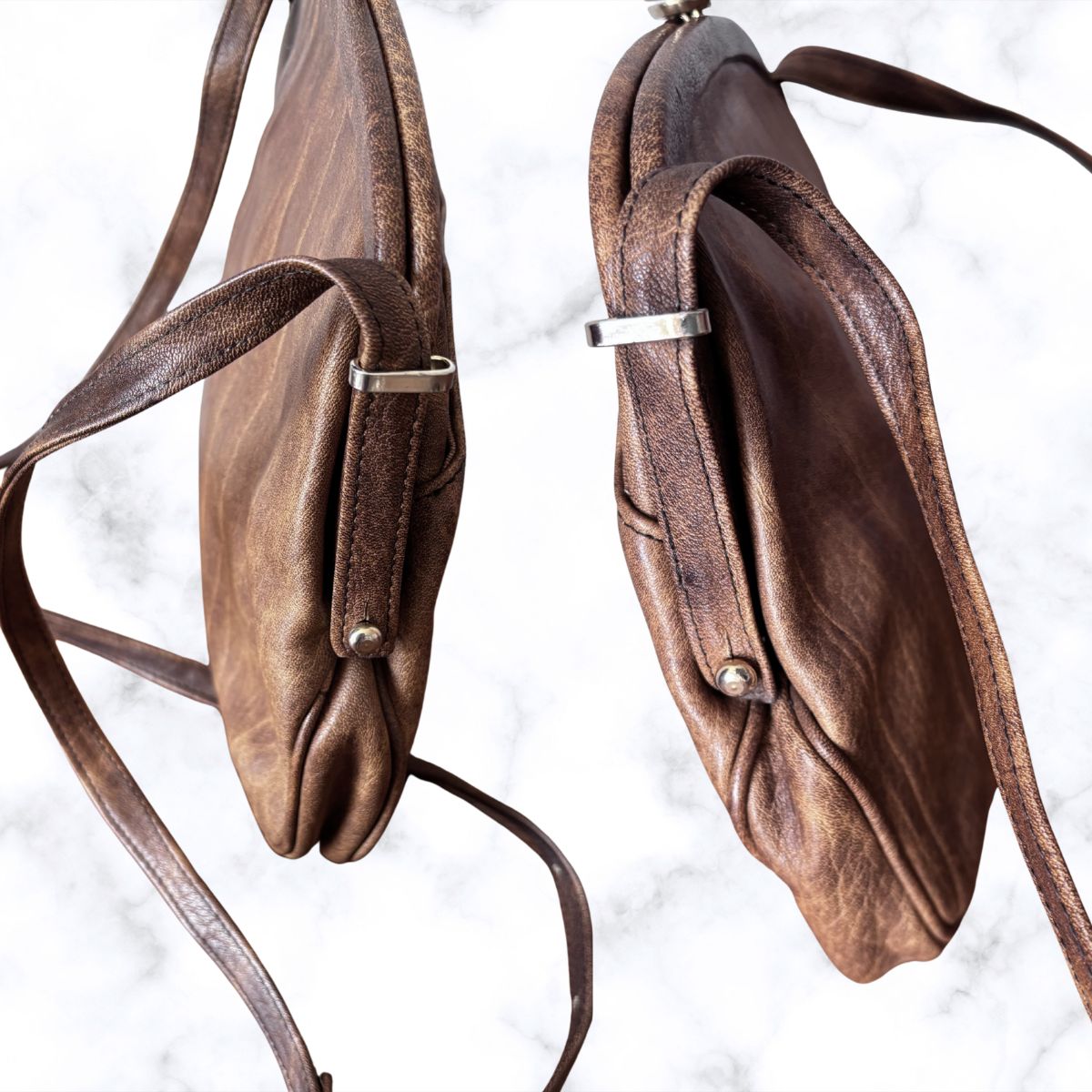 brown leather look bag with straps on a white background