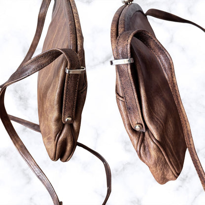brown leather look bag with straps on a white background