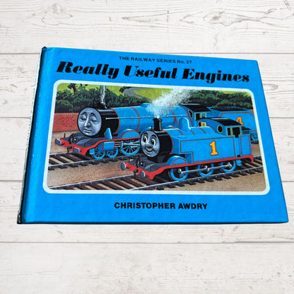 Book titled 'Really Useful Engines' by Christopher Awdry with a blue train on the cover.