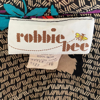 Vintage botanical print dress with flutter sleeves and pussy bow collar . Approx  U.K size 10-12