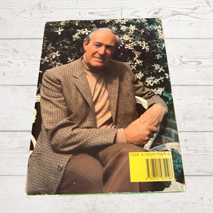 Vintage photo of a man in a suit with a floral background on a wooden surface
