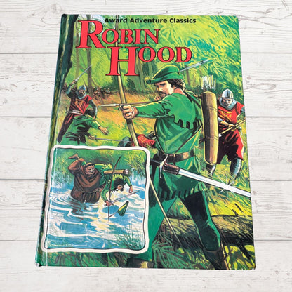 Book cover of 'Robin Hood' with illustrations of Robin Hood and his companions on a wooden surface.