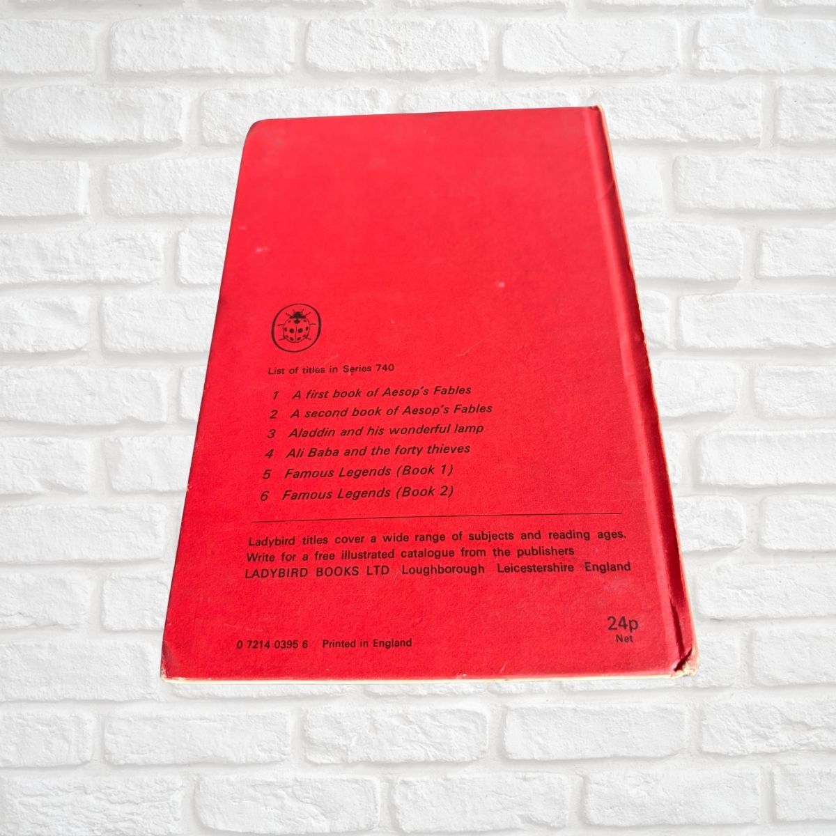 Red vintage ladybird book with list of titles 