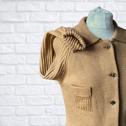 Textured knit cardigan with ribbed sleeves on a white background 