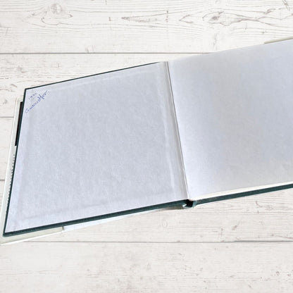 Open book on a light wooden surface