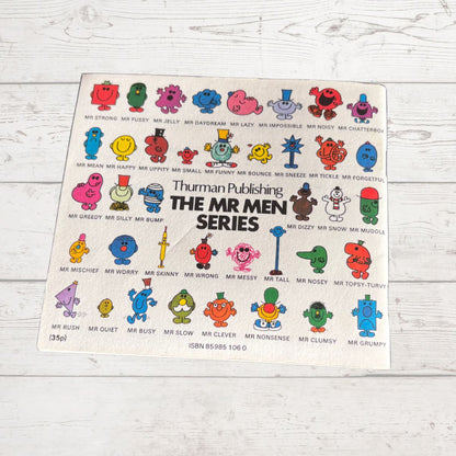 Poster of Mr. Men characters from Thuman Publishing on a wooden surface
