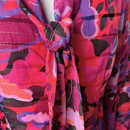 Close-up of a colorful patterned fabric with a knot.