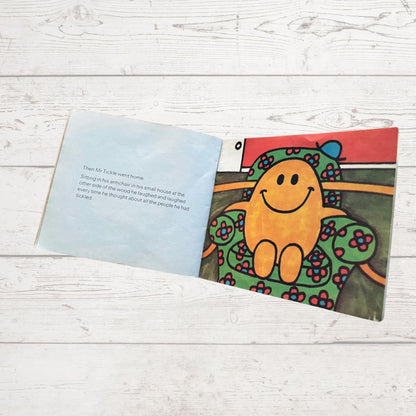 Mr tickle reaching his arms from a chair 