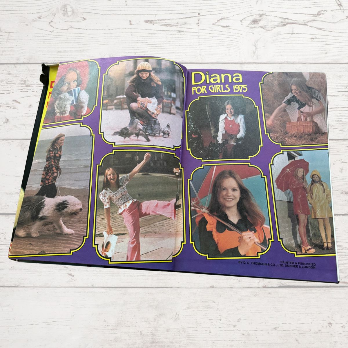 Vintage Diana Annual 1975 open on a white wood background 