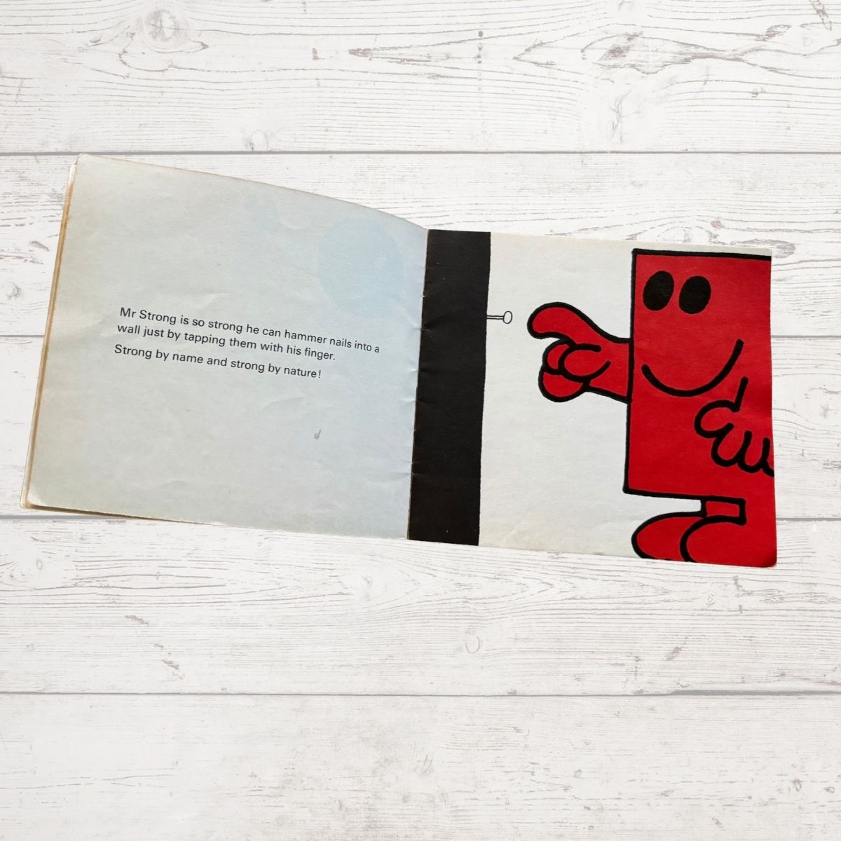 Mr strong using his finger to hammer a nail 