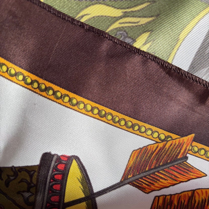 Close-up of a patterned fabric with arrows and decorative elements.