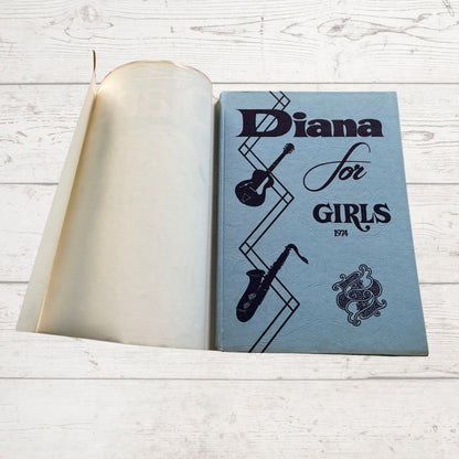 vintage Diana Annual 1974 on a white wood background 