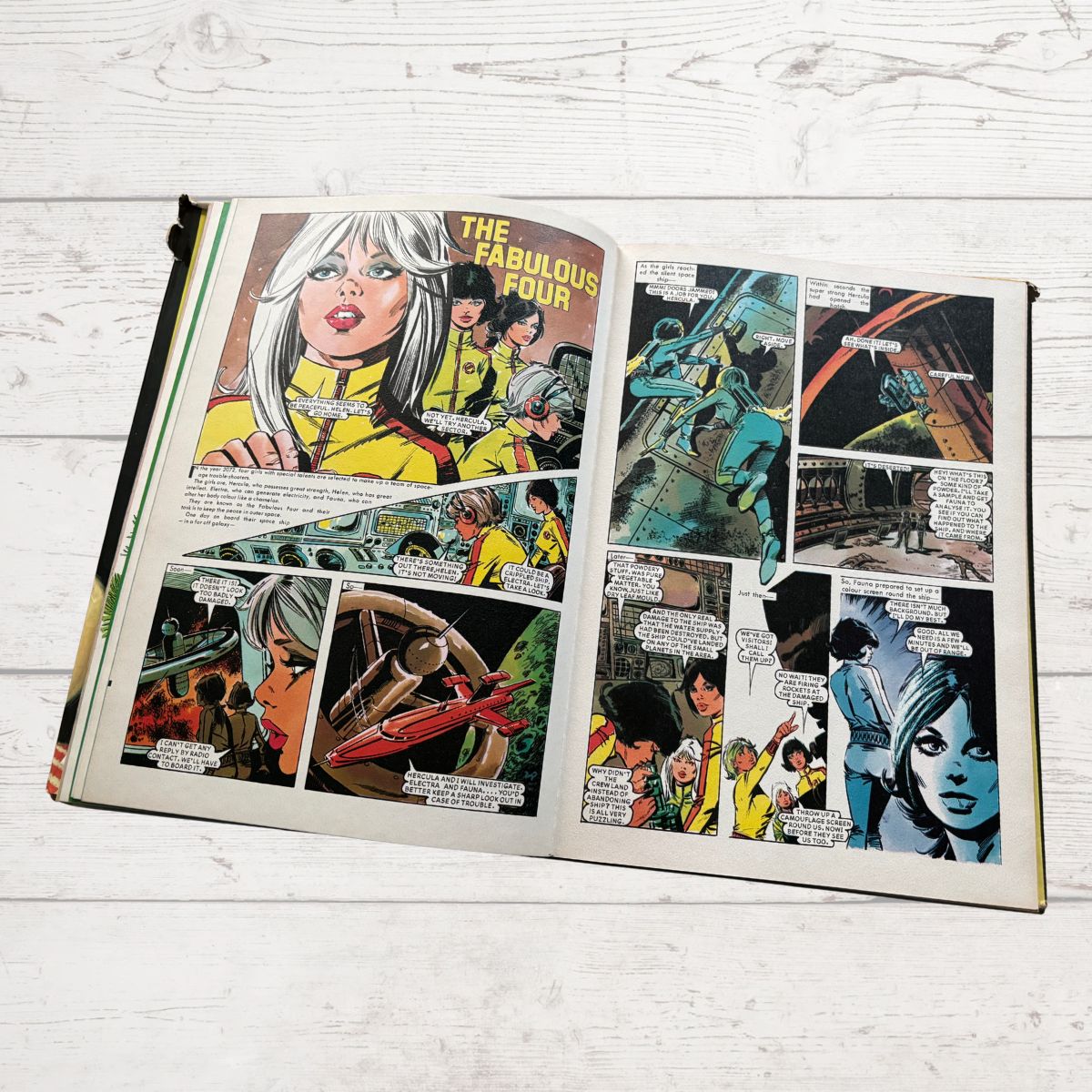 Vintage Diana Annual 1975 open on a white wood background 