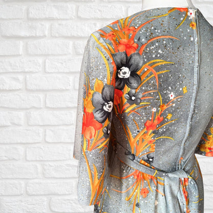 70s Hawaiian vintage maxi dress in an orange floral print.  Approx U.K. size 4-6