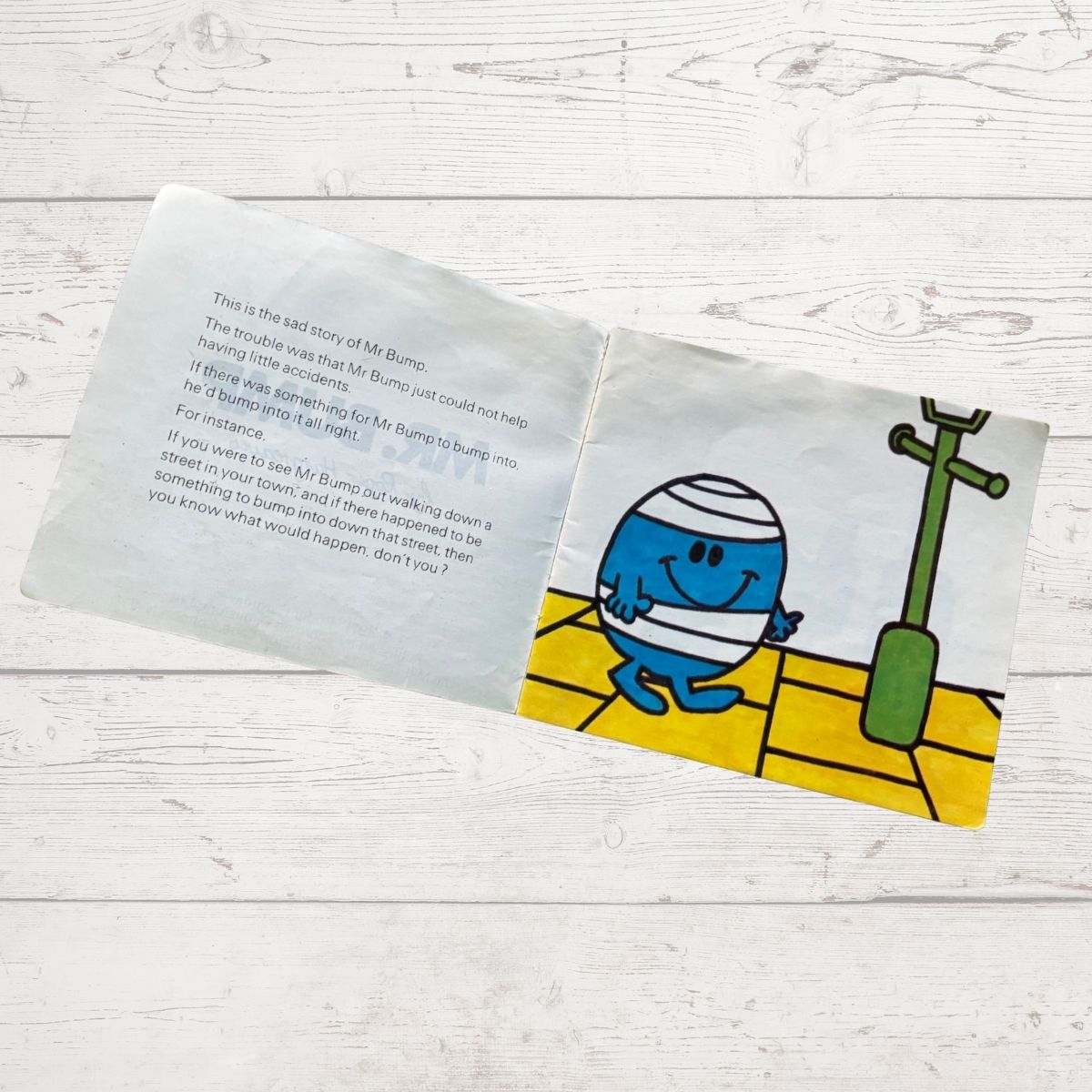 Mr bump next to a lamppost 