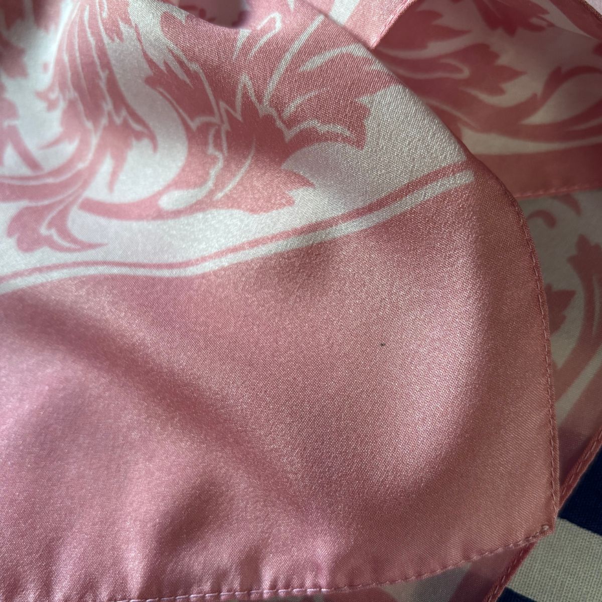 Close-up of a pink fabric with a floral pattern
