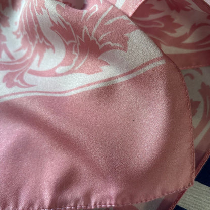 Close-up of a pink fabric with a floral pattern