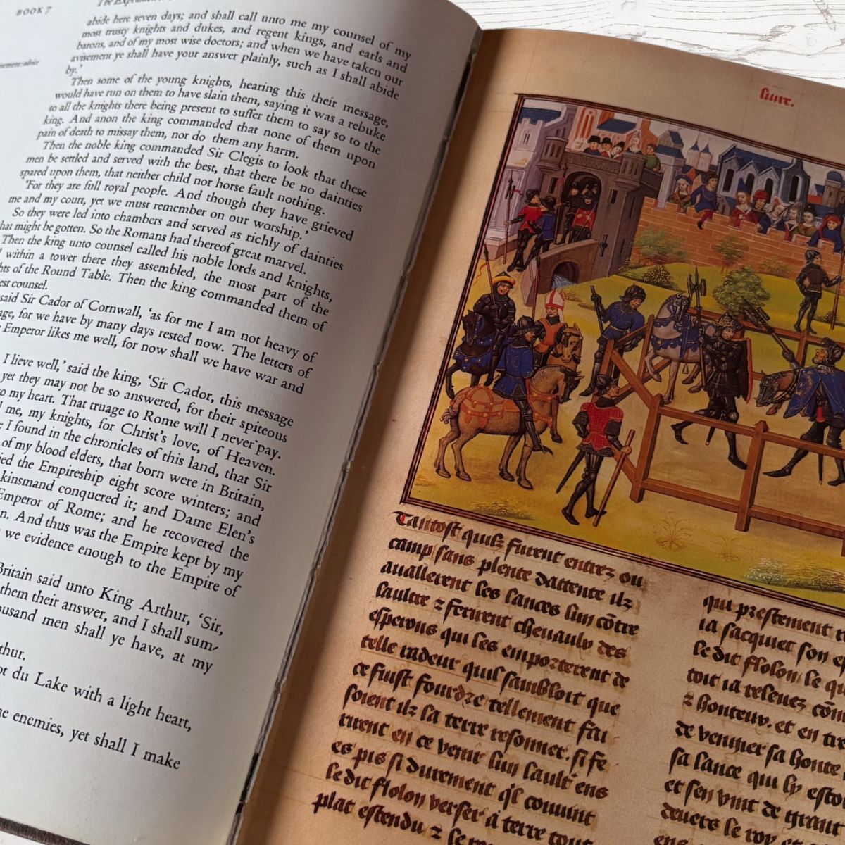 Open book with medieval illustrations and text