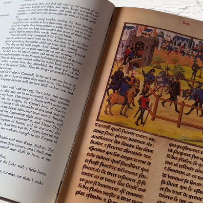 Open book with medieval illustrations and text