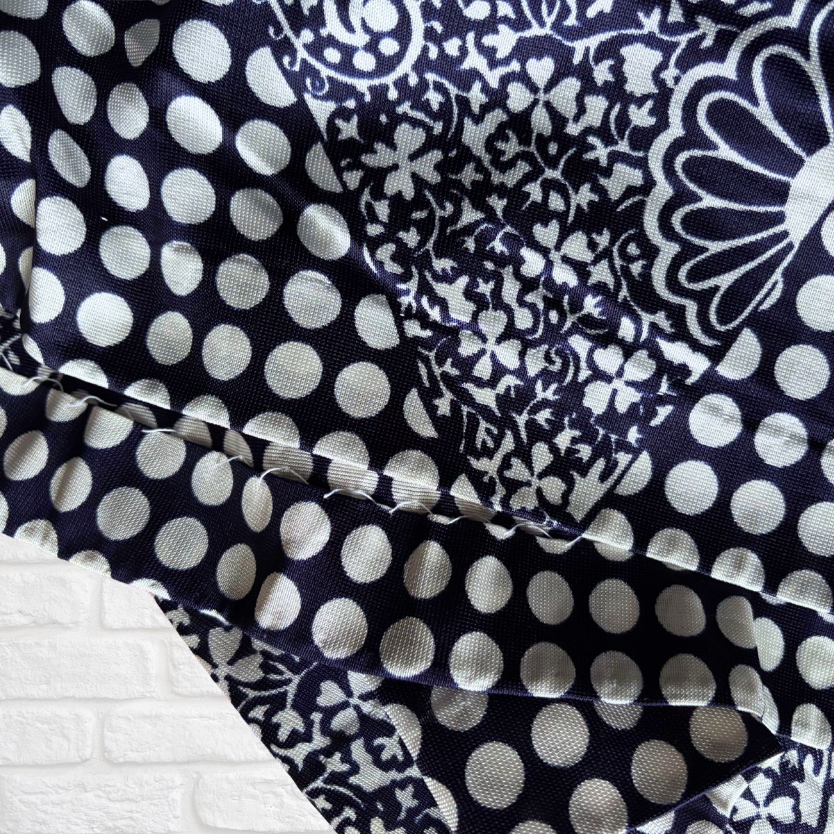 Close up of the hem stitching On a vintage dress