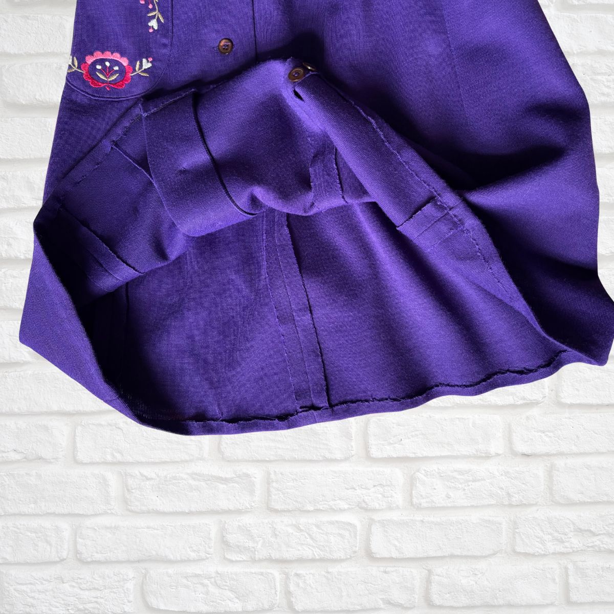 Hem of purple vintage  skirt 