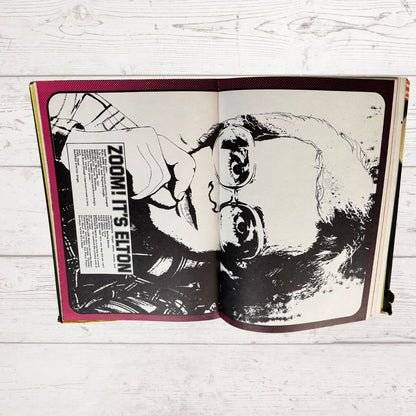 Vintage Diana Annual 1975 open on a white wood background 