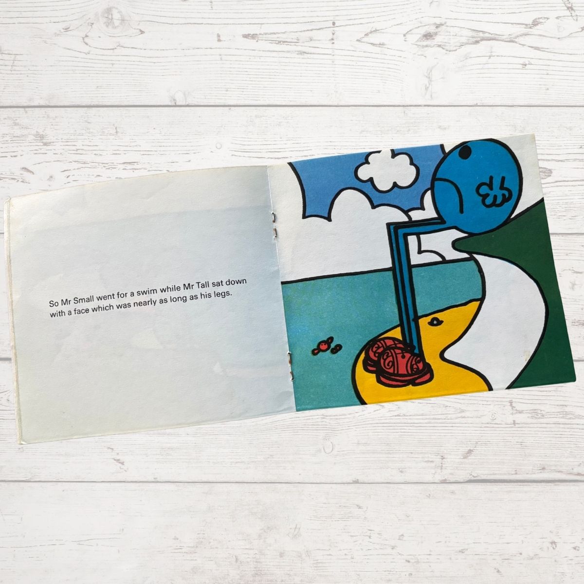 Mr Tall looking sad sat on a cliff 