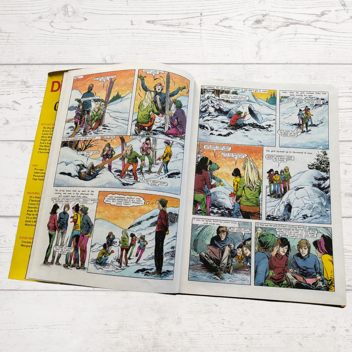 vintage Diana Annual 1974 open on a white wood background 