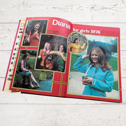 Vintage Diana annual 1976 open on a white wood background 