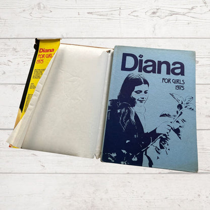 Vintage Diana Annual 1975 on a white wood background 