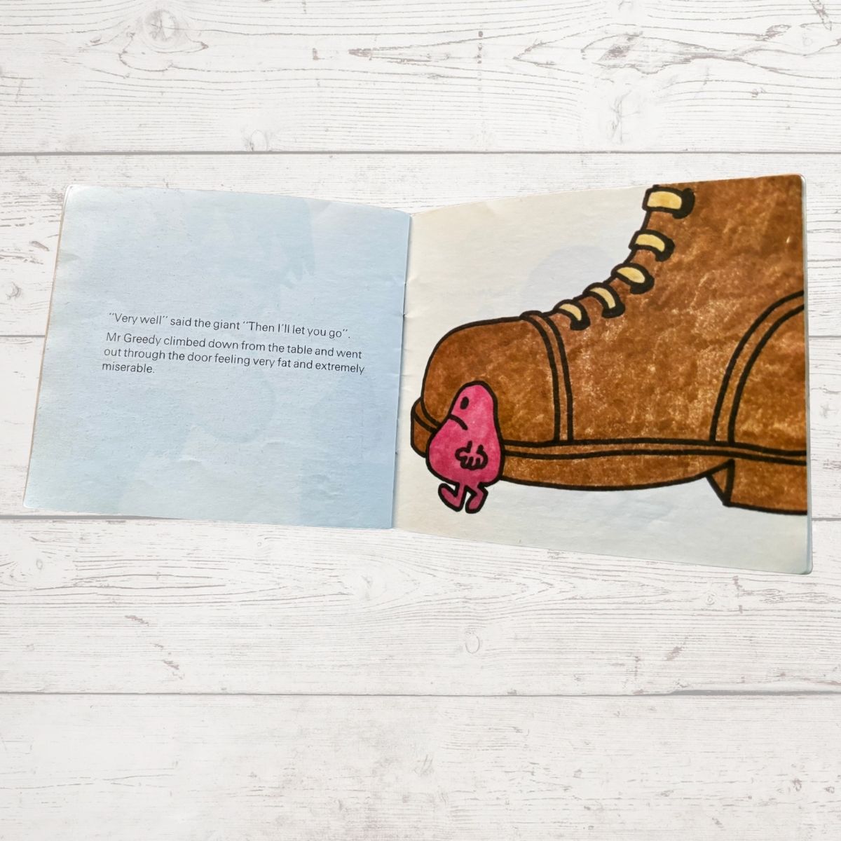 Mr Greedy next to a big shoe 