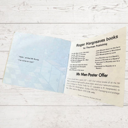 Open book with text on a wooden surface