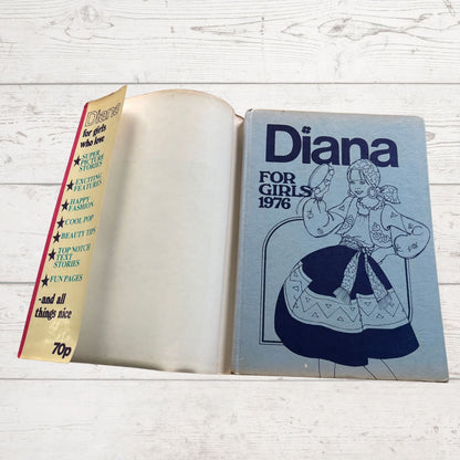 Vintage Diana annual 1976 on a white wood background 