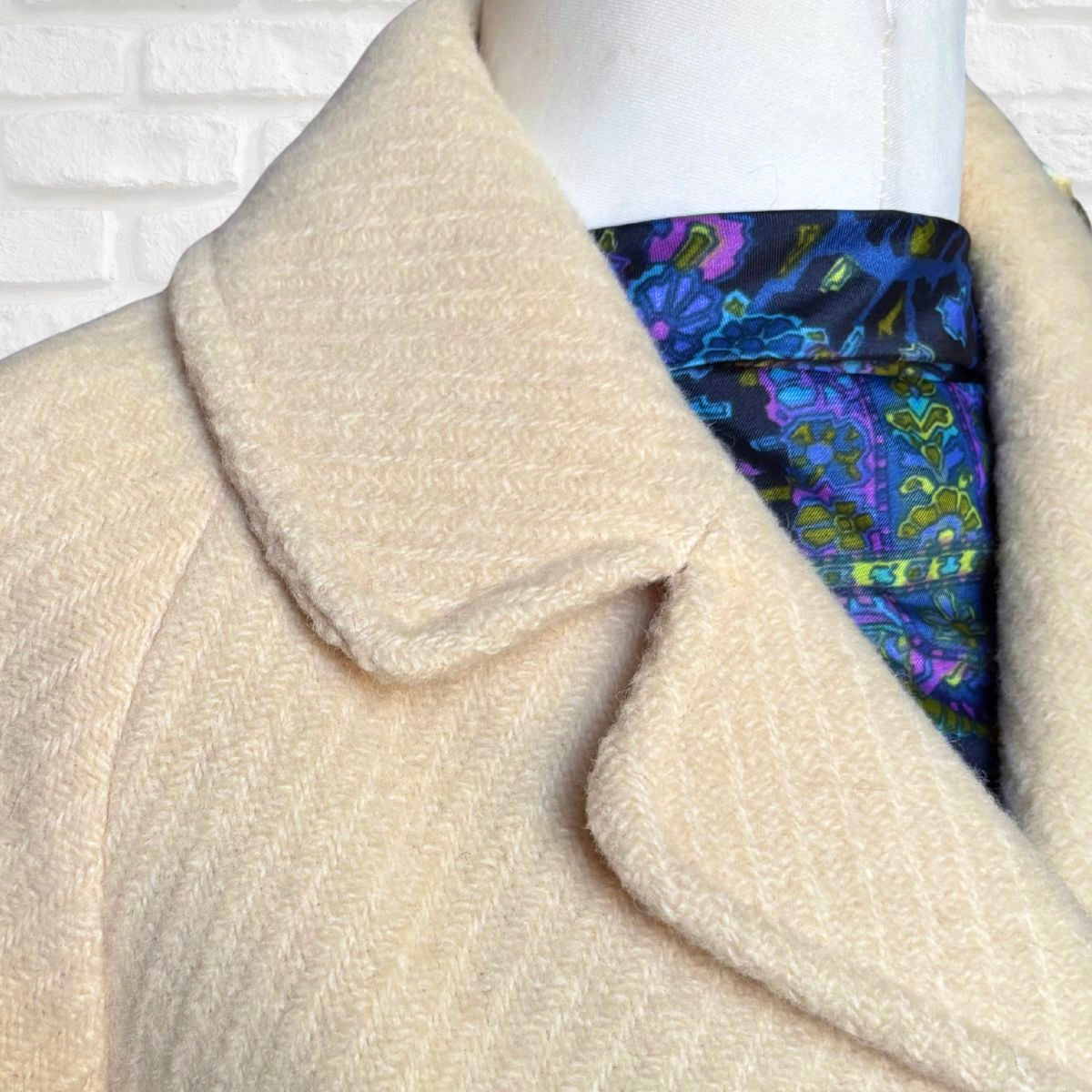 Close-up of a cream vintage coat collar 