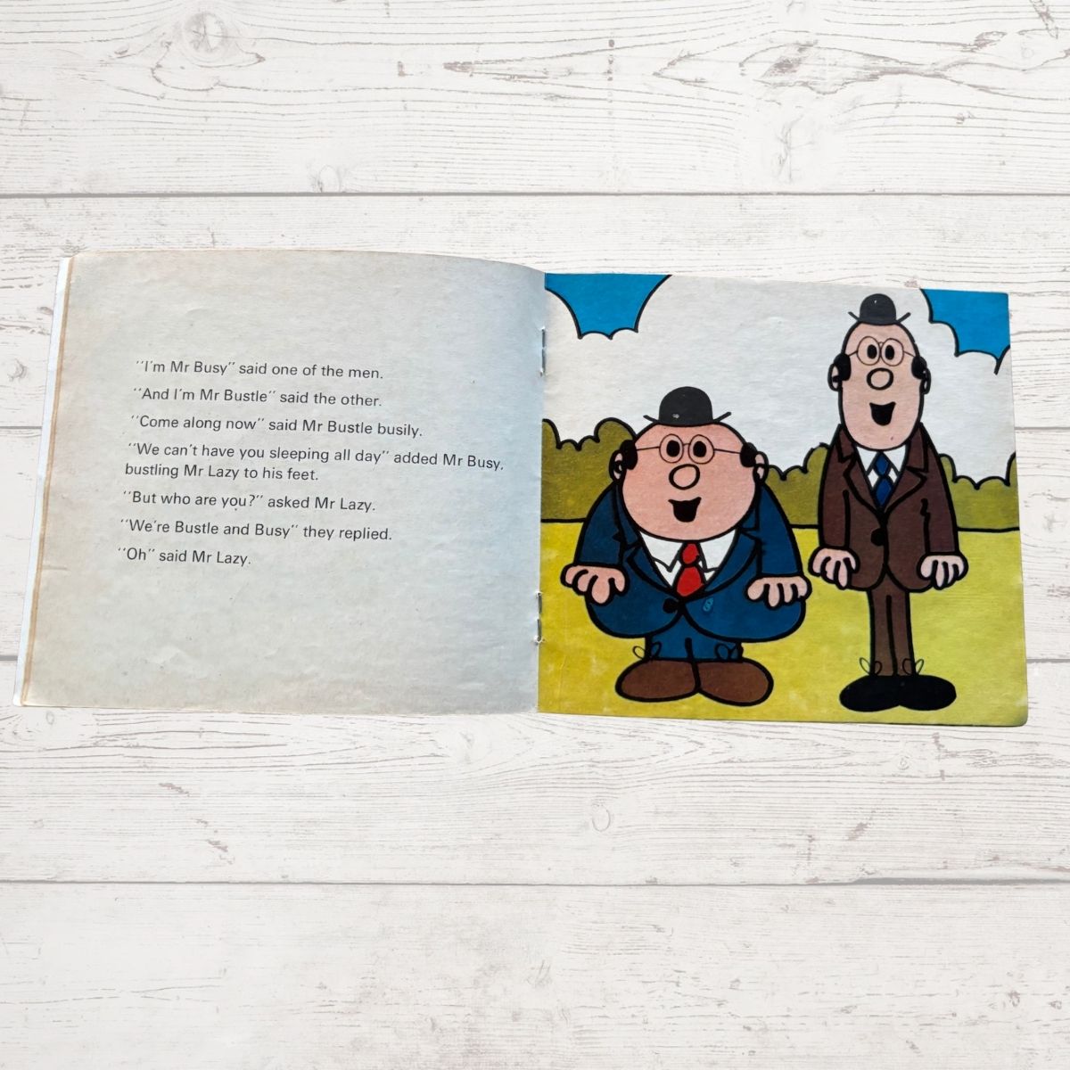 Two cartoon men one tall and one short 